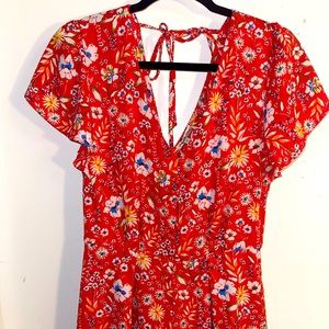 Ditsy floral red romper size medium from Charlotte Russe with tie back